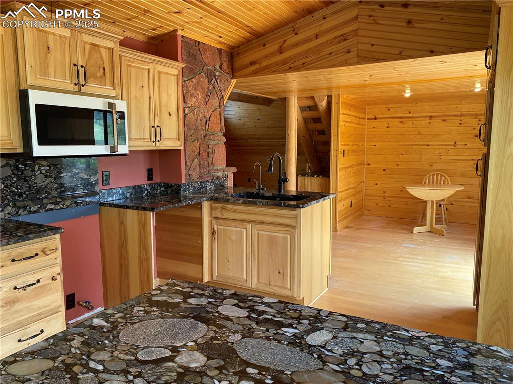 845 Markus Road Woodland Park, CO 80863 - Photo 22 of 40 a bathroom with a sink and a mirror
