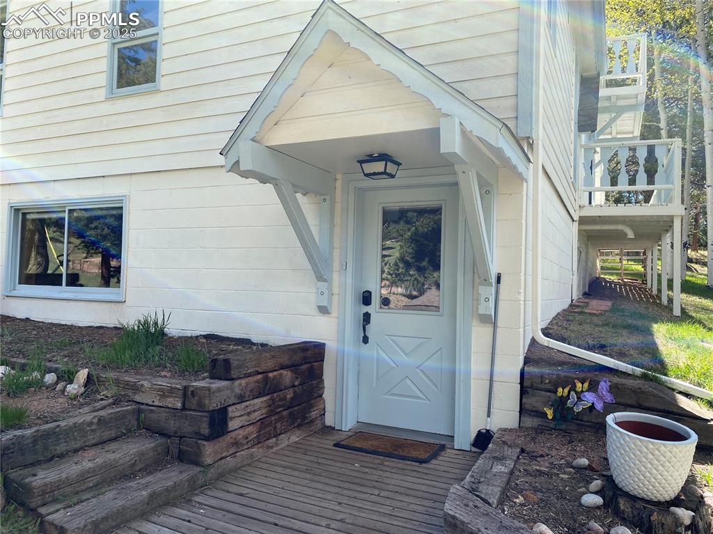 845 Markus Road Woodland Park, CO 80863 - Photo 6 of 40 a view of living room and patio