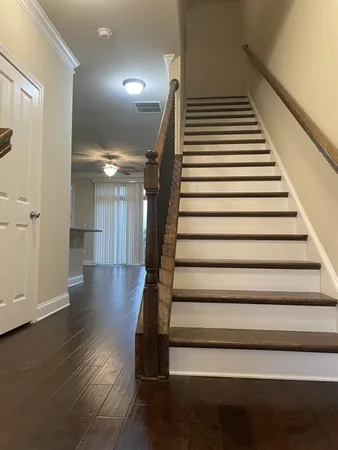 a view of entryway and hall with wooden floor