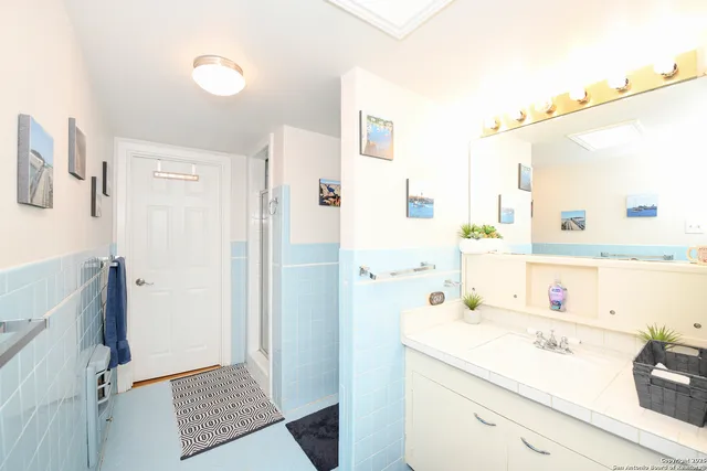 a bathroom with a sink and a mirror