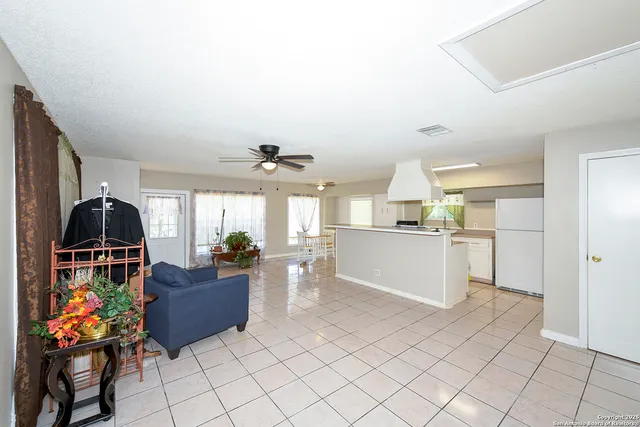 a view of living room with furniture and window