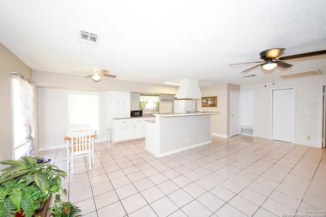 a view of kitchen with furniture and wooden floor