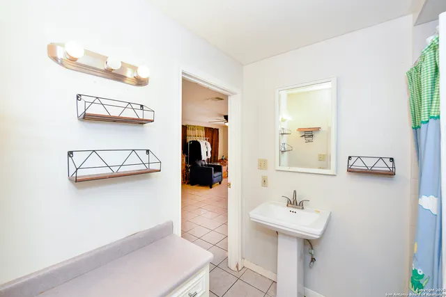a bathroom with a sink and a mirror