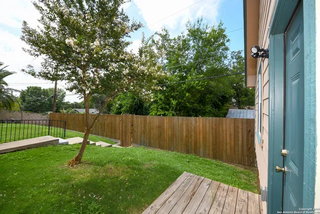 a view of a backyard with a slide