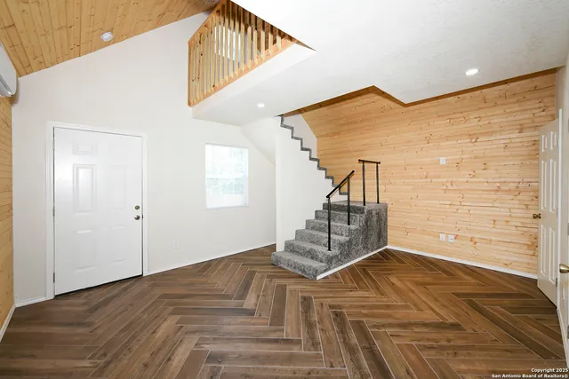 a view of a staircase and white walls