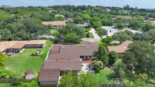 an aerial view of a house with a garden