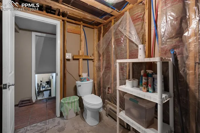 a bathroom with a toilet and a sink