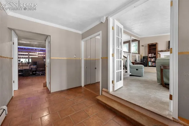 a view of a livingroom with furniture and front door