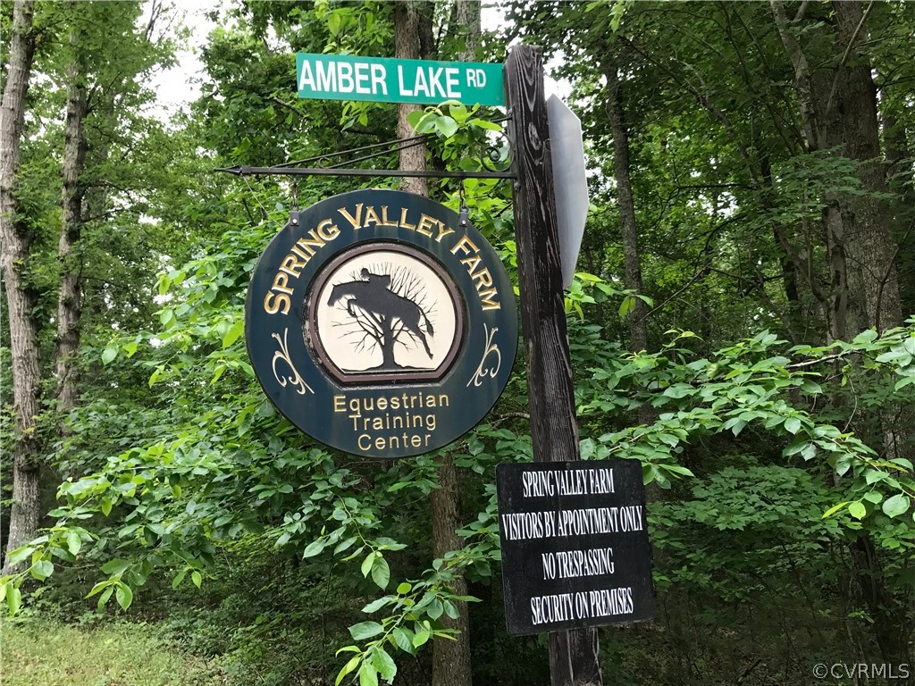 1601 Genito Road Crozier, VA 23039 - Photo 7 of 13 a sign that is sitting on a wooden fence