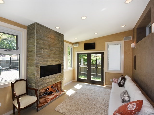 7715 East Prairie Road Skokie, IL 60076 - Photo 13 of 26 a living room with furniture and a fireplace