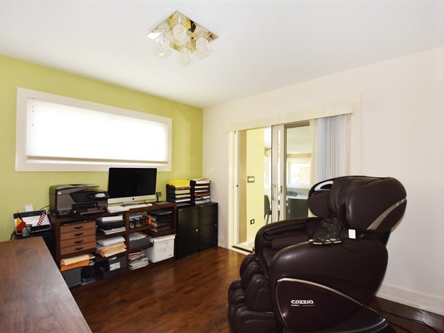 7715 East Prairie Road Skokie, IL 60076 - Photo 18 of 26 a living room with furniture and a flat screen tv