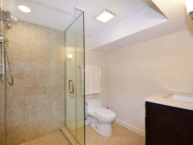 7715 East Prairie Road Skokie, IL 60076 - Photo 23 of 26 a bathroom with a toilet and a shower