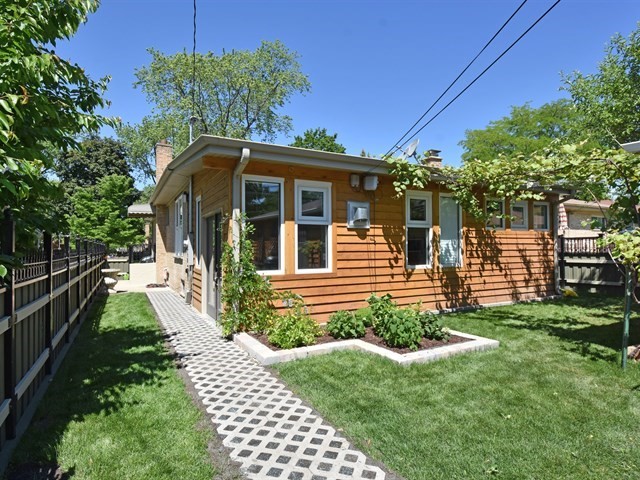 7715 East Prairie Road Skokie, IL 60076 - Photo 26 of 26 a front view of a house with a yard