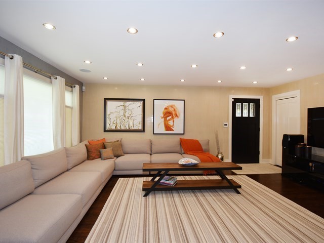 7715 East Prairie Road Skokie, IL 60076 - Photo 4 of 26 a living room with furniture and wooden floor