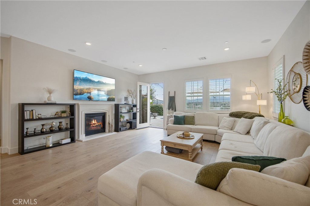 26464 Township Street Saugus, CA 91350 - Photo 12 of 74 a living room with furniture a fireplace and a flat screen tv