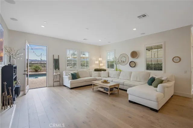 a living room with fireplace furniture and a flat screen tv