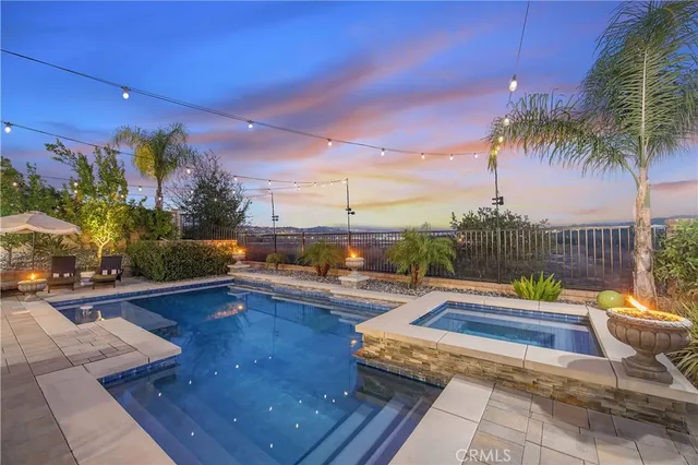 an aerial view of a house with garden space and street view