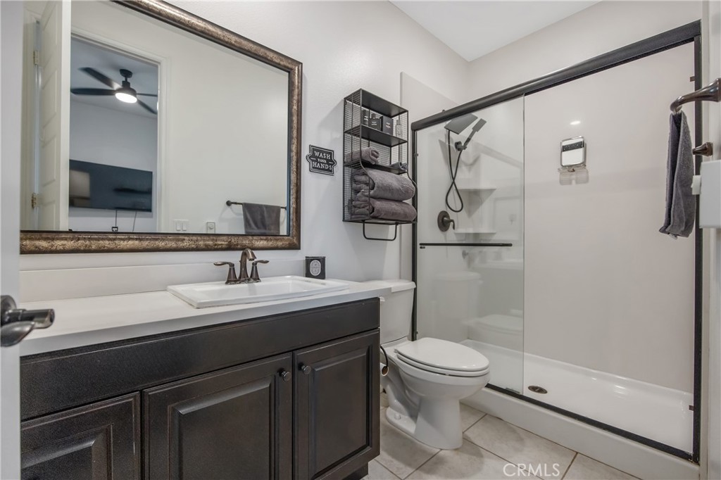 26464 Township Street Saugus, CA 91350 - Photo 22 of 74 a bathroom with a sink a toilet and shower