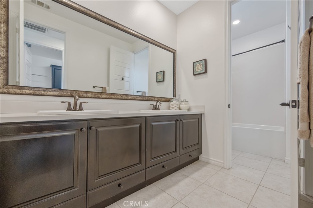 26464 Township Street Saugus, CA 91350 - Photo 38 of 74 a bathroom with a sink and a mirror
