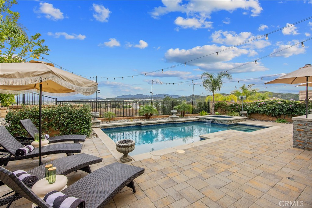 26464 Township Street Saugus, CA 91350 - Photo 44 of 74 a view of a swimming pool with outdoor seating space