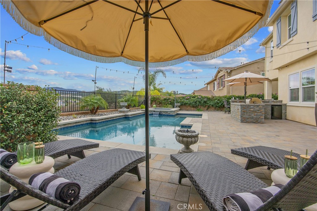 26464 Township Street Saugus, CA 91350 - Photo 45 of 74 a view of a patio with couches under an umbrella