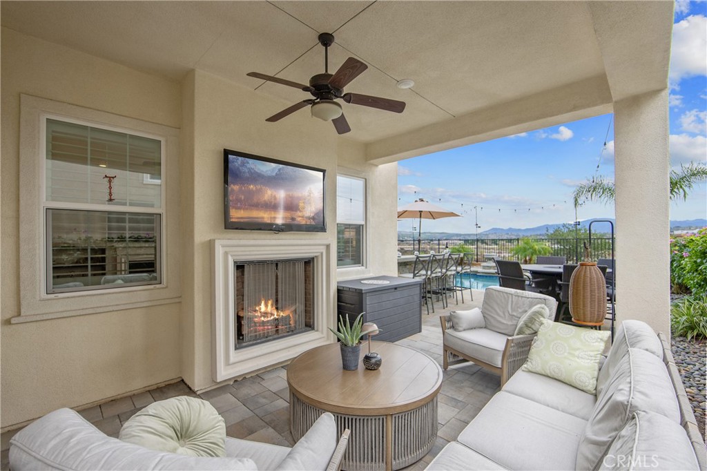 26464 Township Street Saugus, CA 91350 - Photo 58 of 74 a living room with furniture ceiling fan and a fireplace