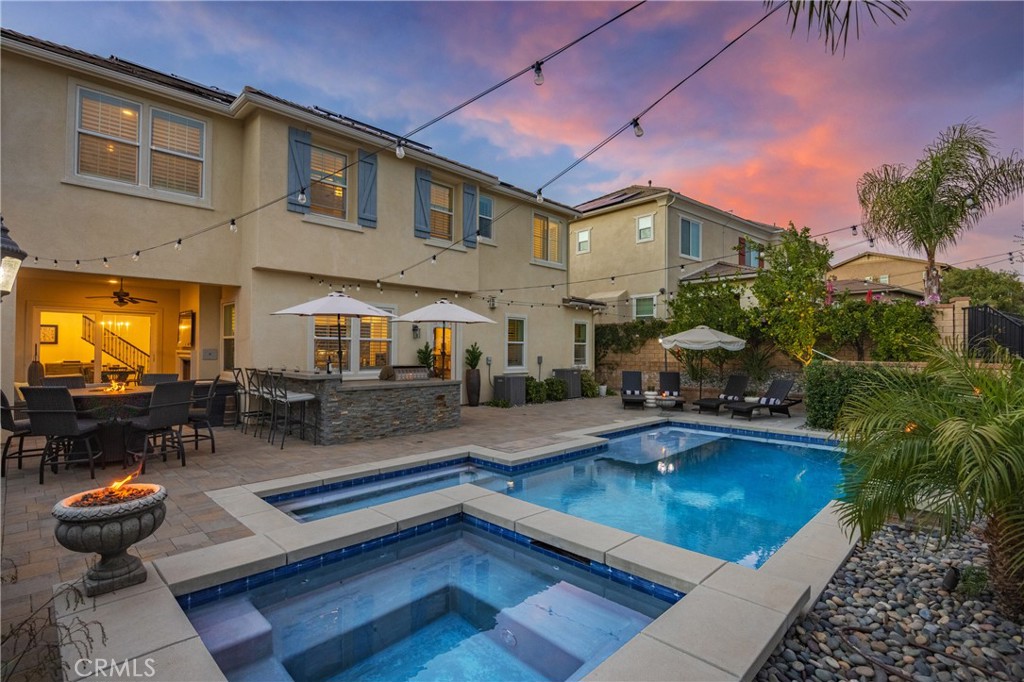 26464 Township Street Saugus, CA 91350 - Photo 60 of 74 a swimming pool view with a seating space and potted plants
