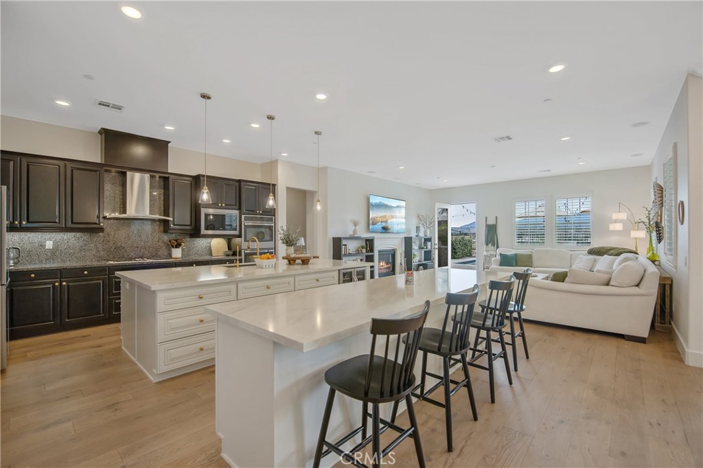 26464 Township Street Saugus, CA 91350 - Photo 8 of 74 a large kitchen with a table and chairs