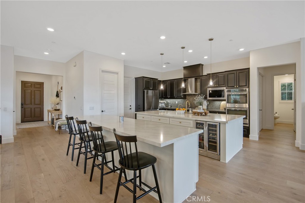26464 Township Street Saugus, CA 91350 - Photo 10 of 74 a kitchen with kitchen island wooden cabinets and counter space