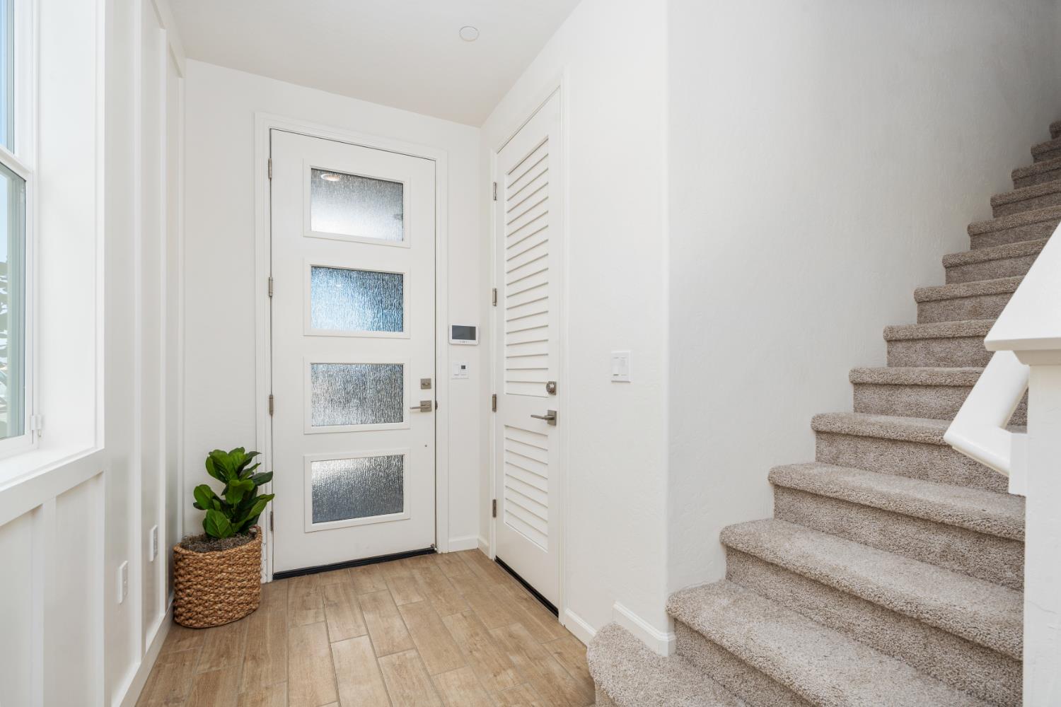 1507 Farmhouse Lane Clovis, CA 93619 - Photo 29 of 33 a view of an entryway with wooden floor and a living room