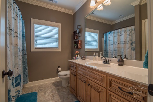 2488 Double Log Cabin Road Lebanon, TN 37087 - Photo 25 of 50 a bathroom with a double vanity sink toilet and a mirror