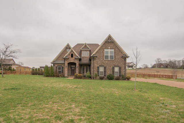 2488 Double Log Cabin Road Lebanon, TN 37087 - Photo 4 of 50 a front view of a house with a yard and lake view