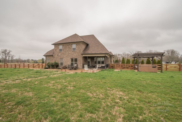 2488 Double Log Cabin Road Lebanon, TN 37087 - Photo 45 of 50 a front view of a house with a garden and porch