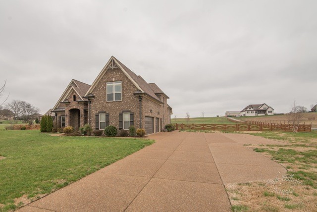 2488 Double Log Cabin Road Lebanon, TN 37087 - Photo 6 of 50 a front view of a house with a yard and lake view