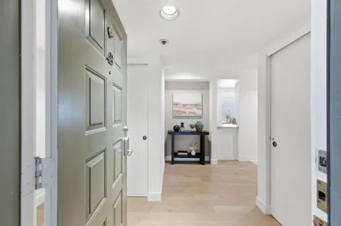 a view of a hallway with dining area