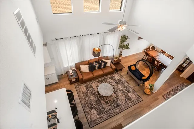 a living room with furniture and a mirror