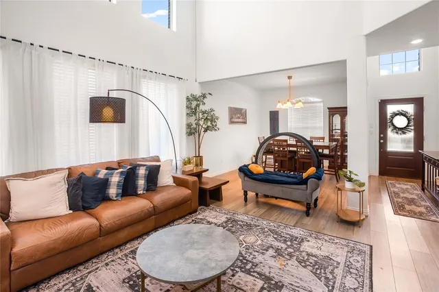 a living room with furniture and a mirror