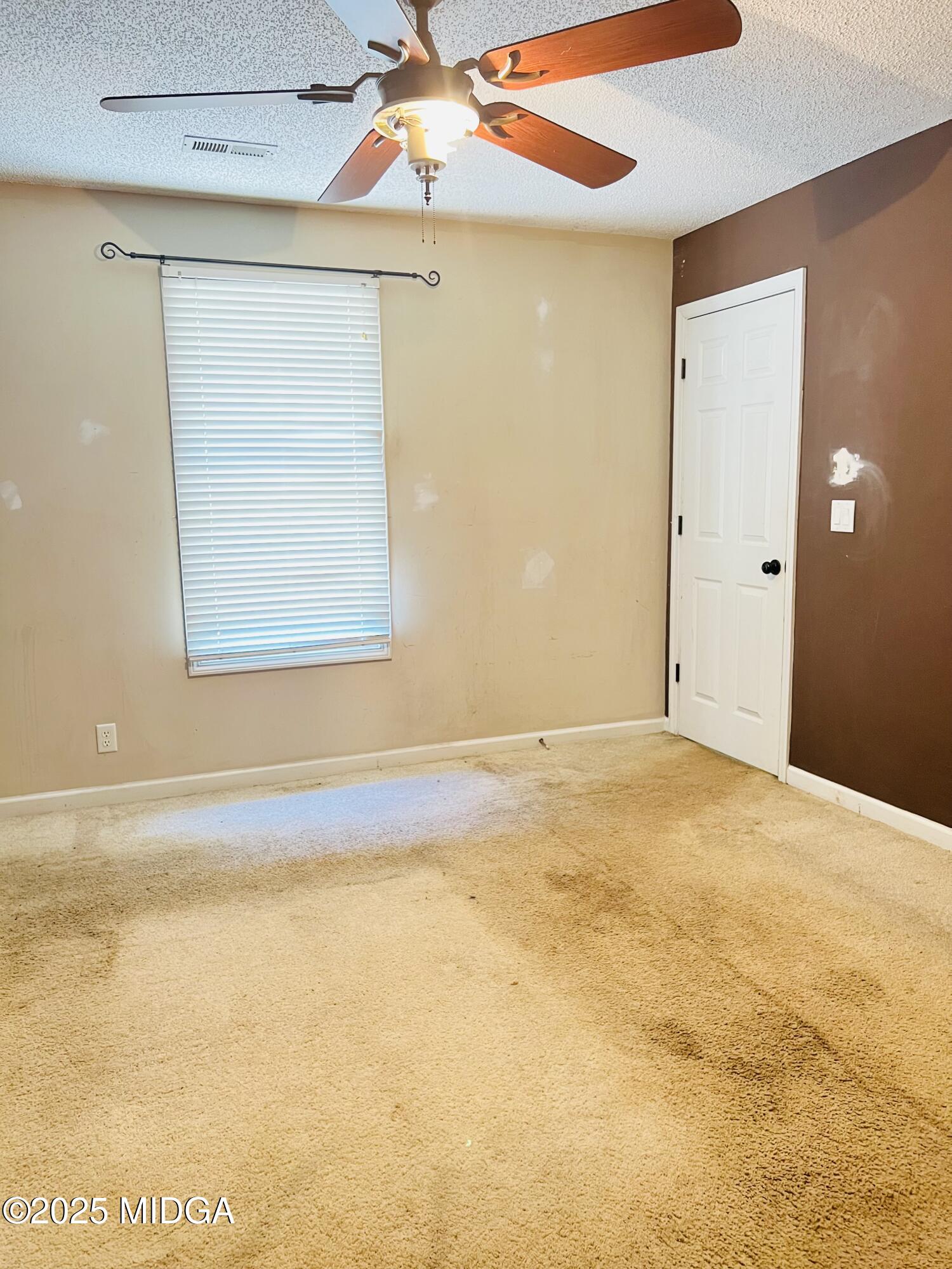 231 Red Berry Road Jackson, GA 30233 - Photo 11 of 23 a view of an empty room with a window