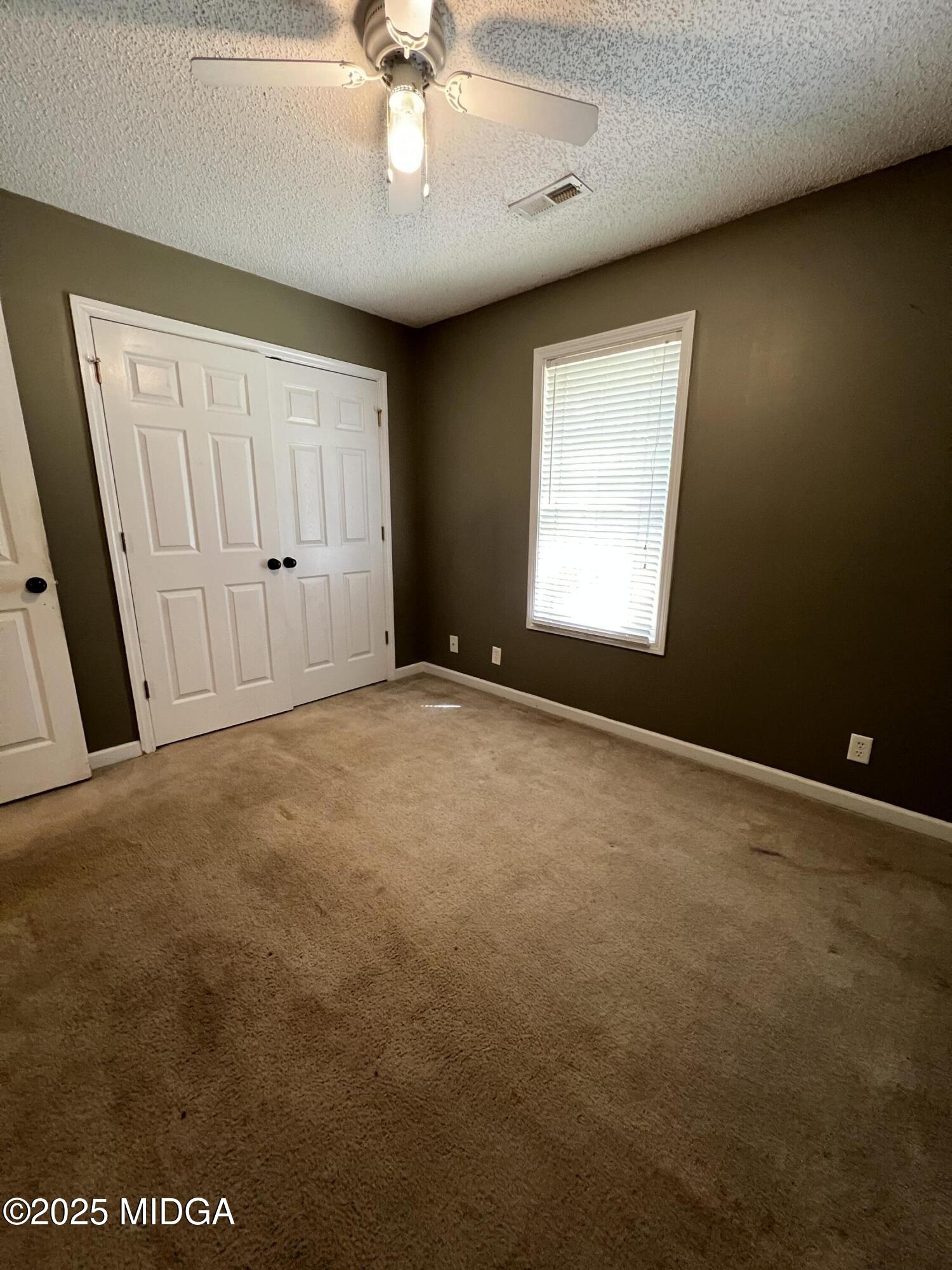 231 Red Berry Road Jackson, GA 30233 - Photo 17 of 23 a view of an empty room with a window