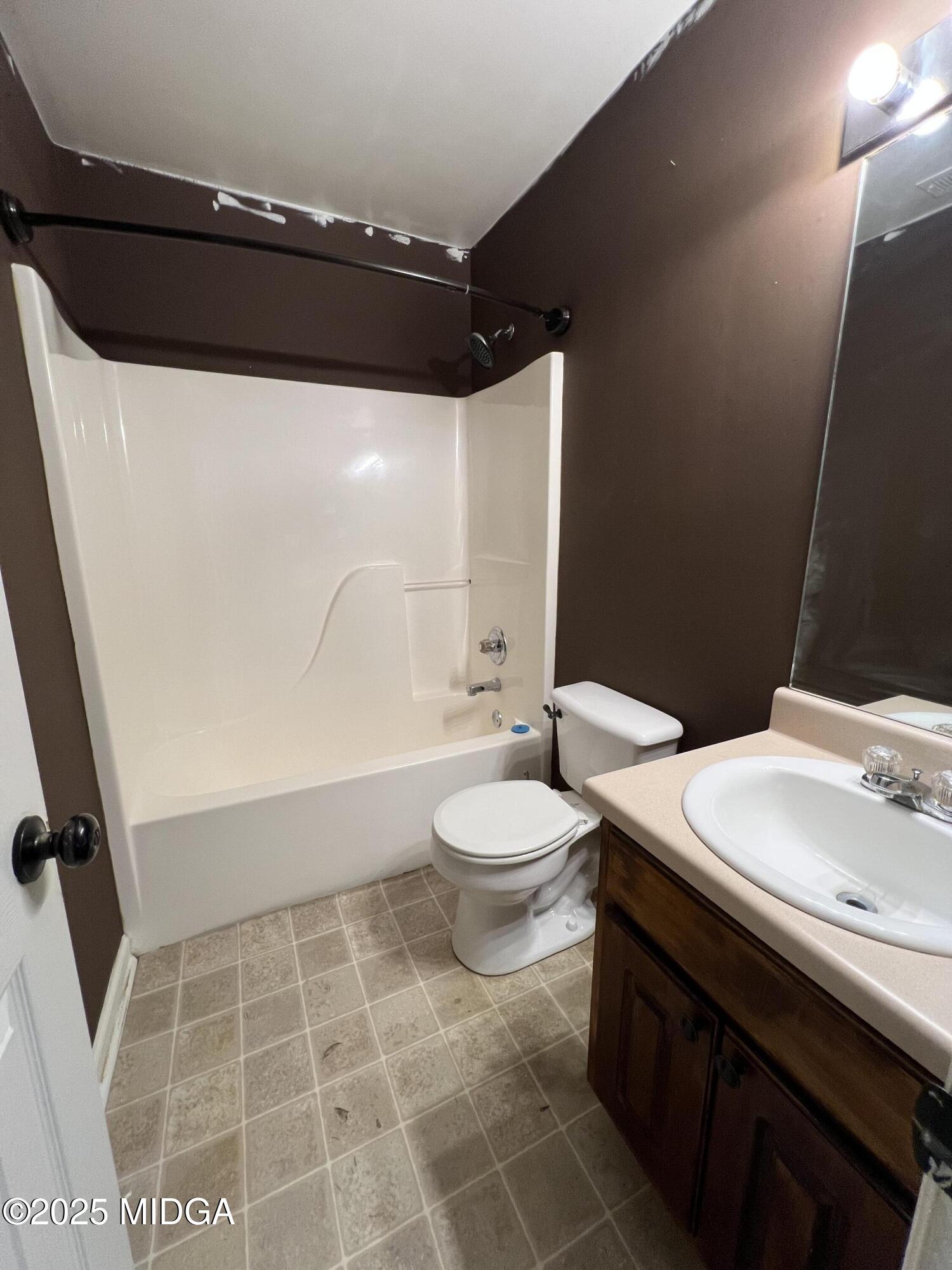 231 Red Berry Road Jackson, GA 30233 - Photo 18 of 23 a bathroom with a sink a toilet and shower