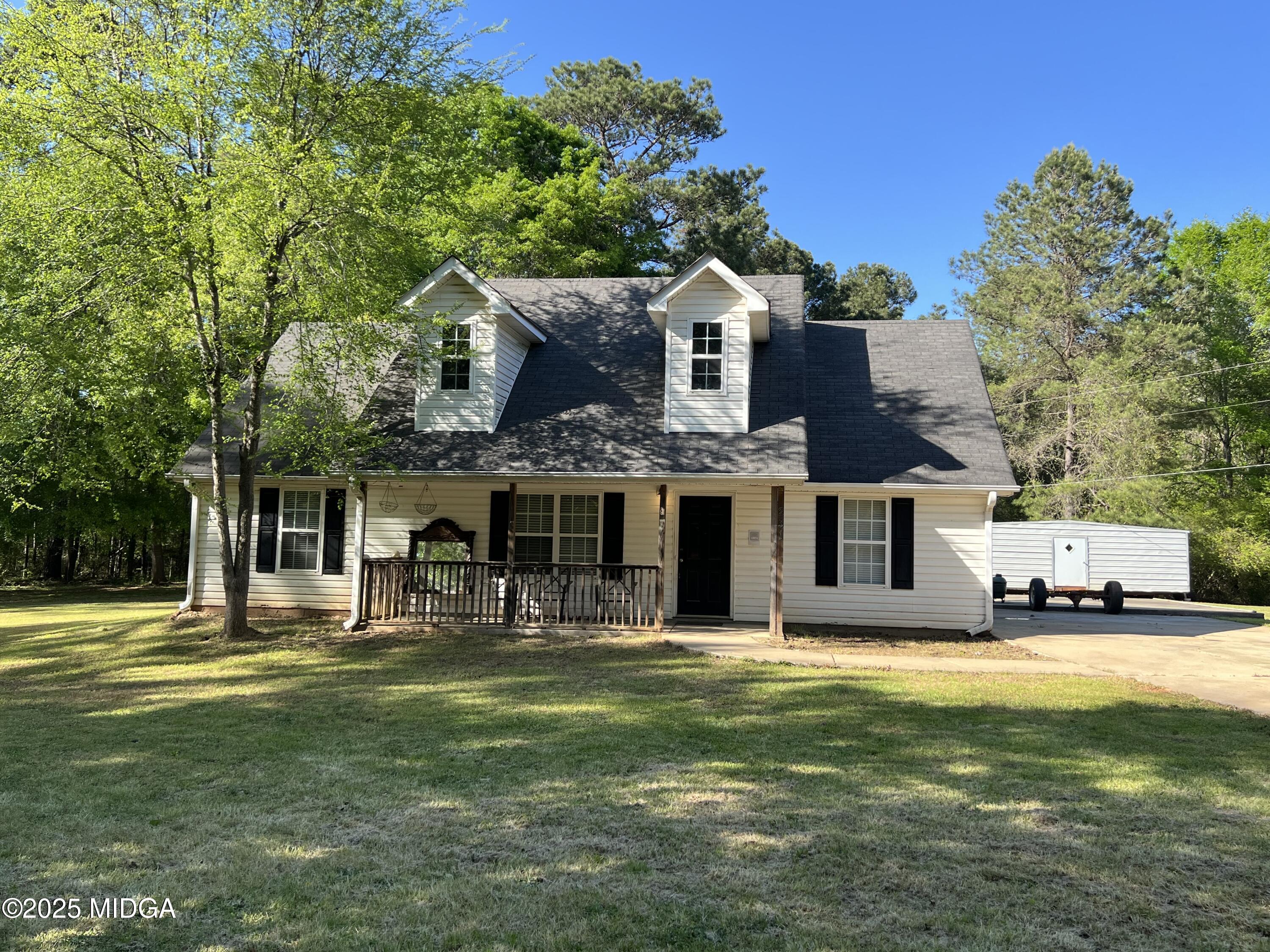 231 Red Berry Road Jackson, GA 30233 - Photo 2 of 23 a front view of a house with a yard