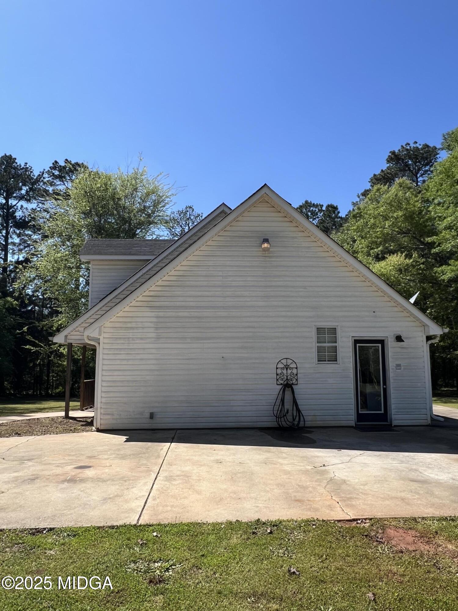 231 Red Berry Road Jackson, GA 30233 - Photo 5 of 23 a view of house with backyard space