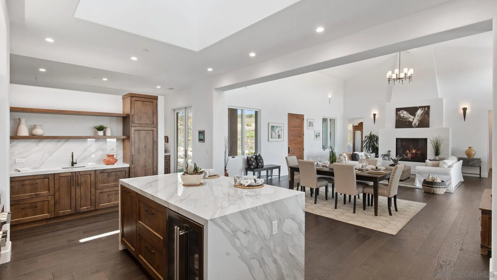 16674 Liberty Ridge San Diego, CA 92127 - Photo 15 of 35 a view of living room with granite countertop lots of white furniture a dining table and chairs
