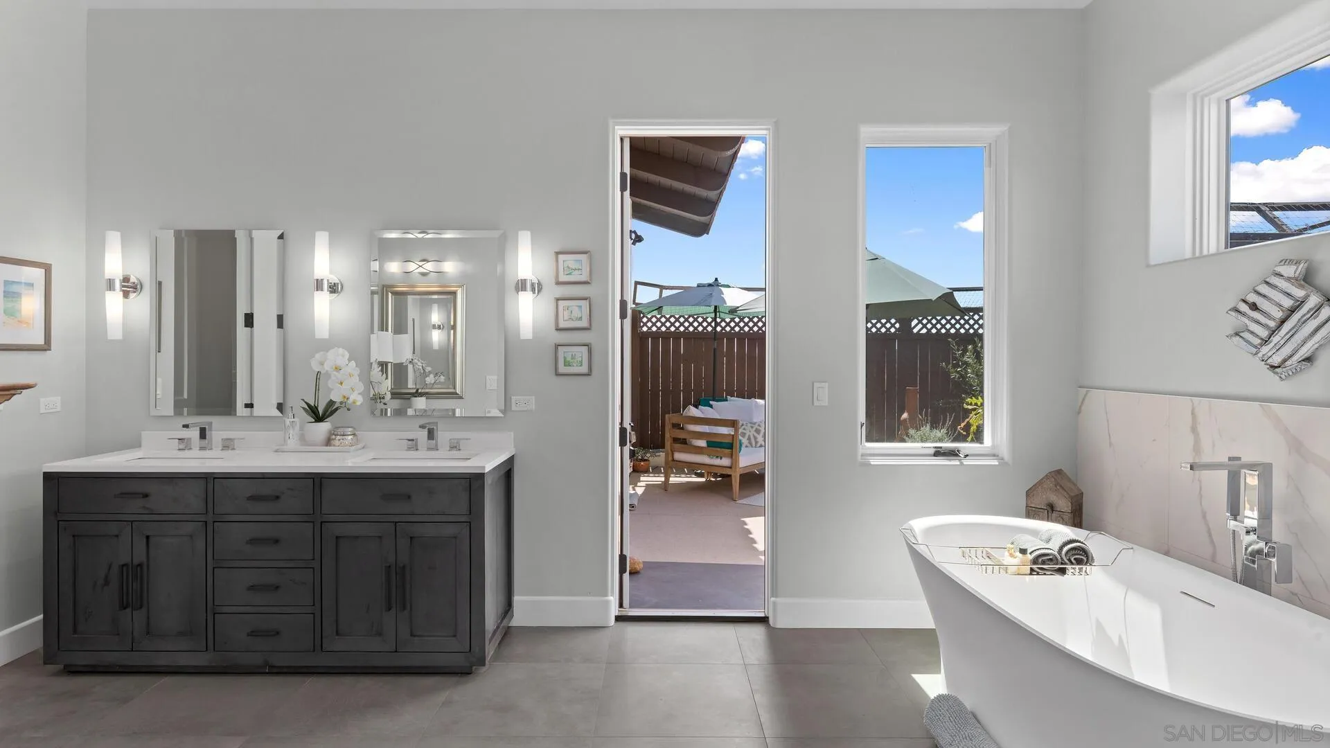 16674 Liberty Ridge San Diego, CA 92127 - Photo 20 of 35 a bathroom with a tub sink and mirror