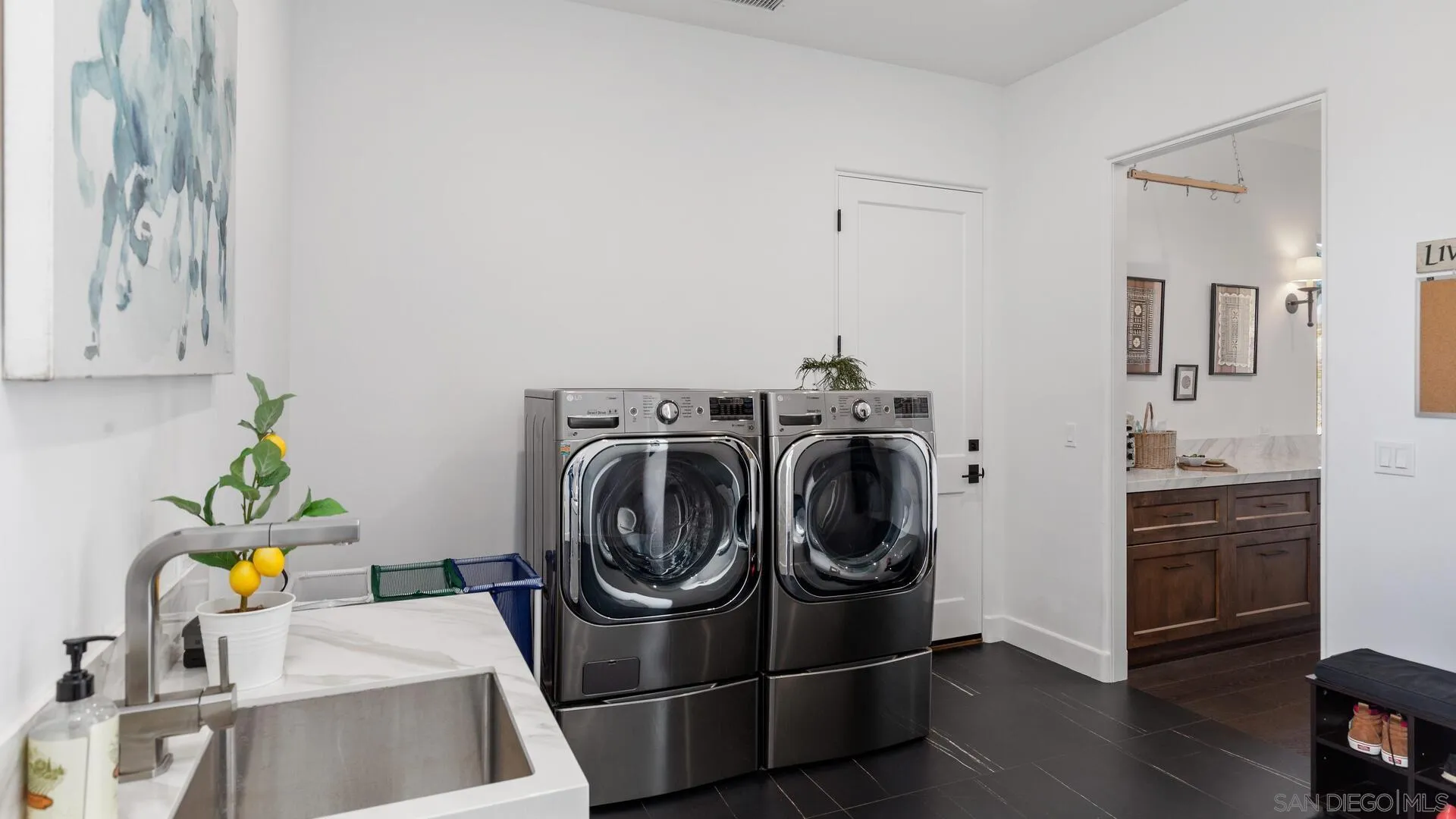 16674 Liberty Ridge San Diego, CA 92127 - Photo 25 of 35 a utility room with sink dryer and washer