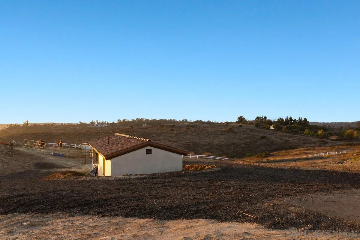 16674 Liberty Ridge San Diego, CA 92127 - Photo 29 of 35 a view of a big house with a mountain view
