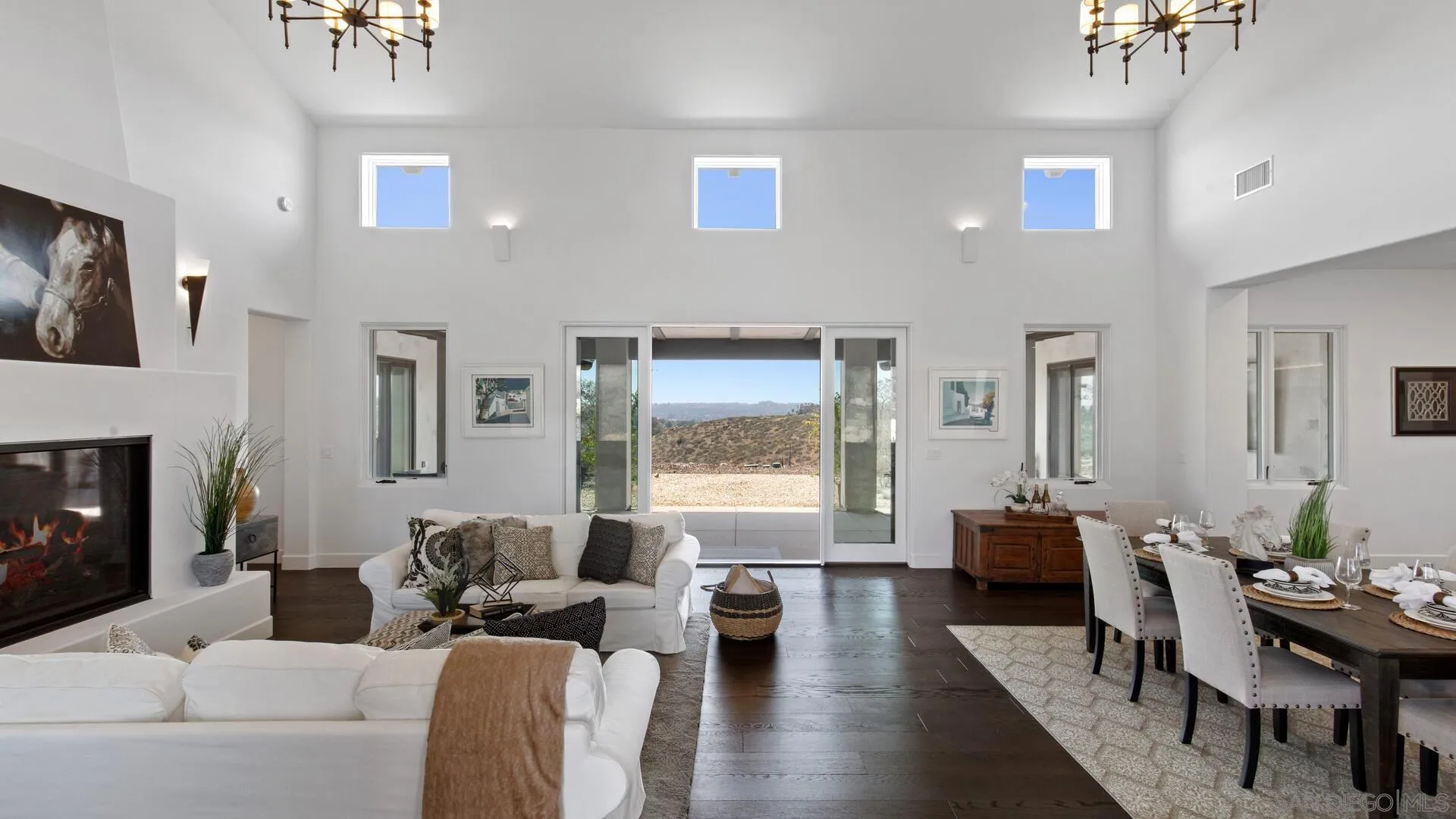 16674 Liberty Ridge San Diego, CA 92127 - Photo 5 of 35 a living room with furniture a fireplace and a large window