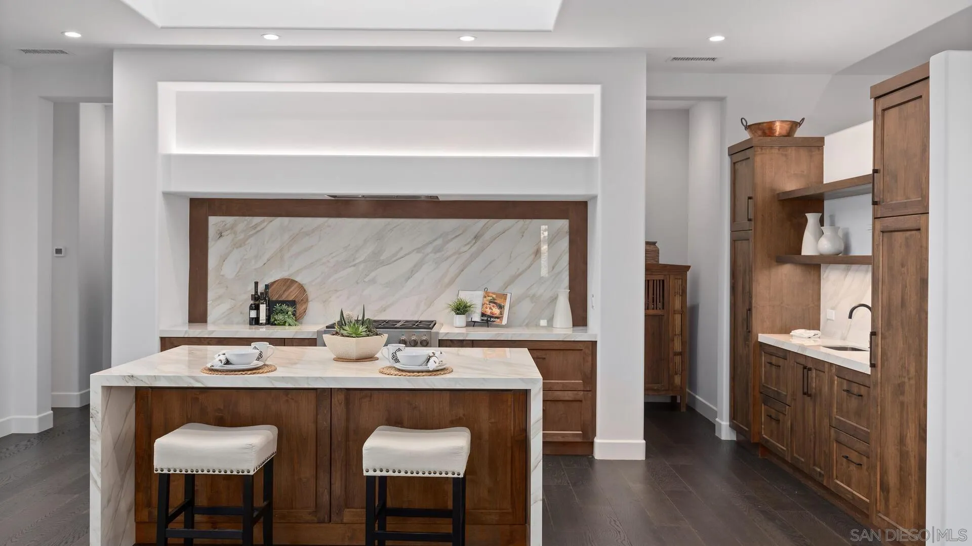 16674 Liberty Ridge San Diego, CA 92127 - Photo 6 of 35 a dining room with a sink and a refrigerator
