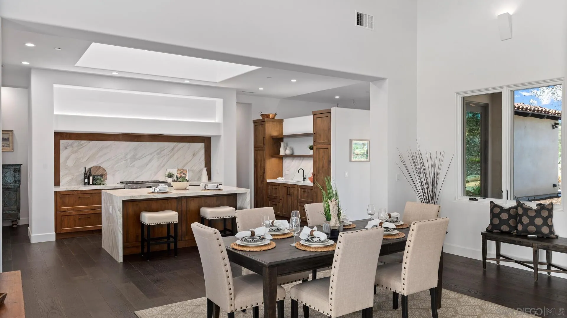 16674 Liberty Ridge San Diego, CA 92127 - Photo 8 of 35 a view of a dining room with furniture and wooden floor