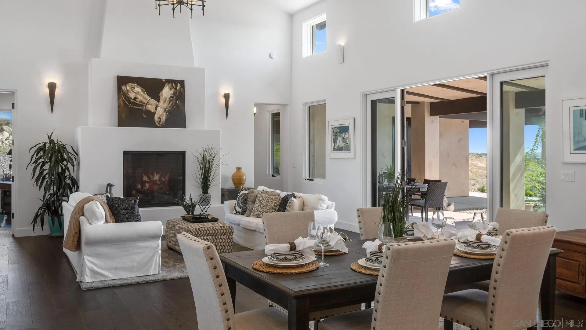 16674 Liberty Ridge San Diego, CA 92127 - Photo 9 of 35 a living room with furniture potted plant and a fireplace